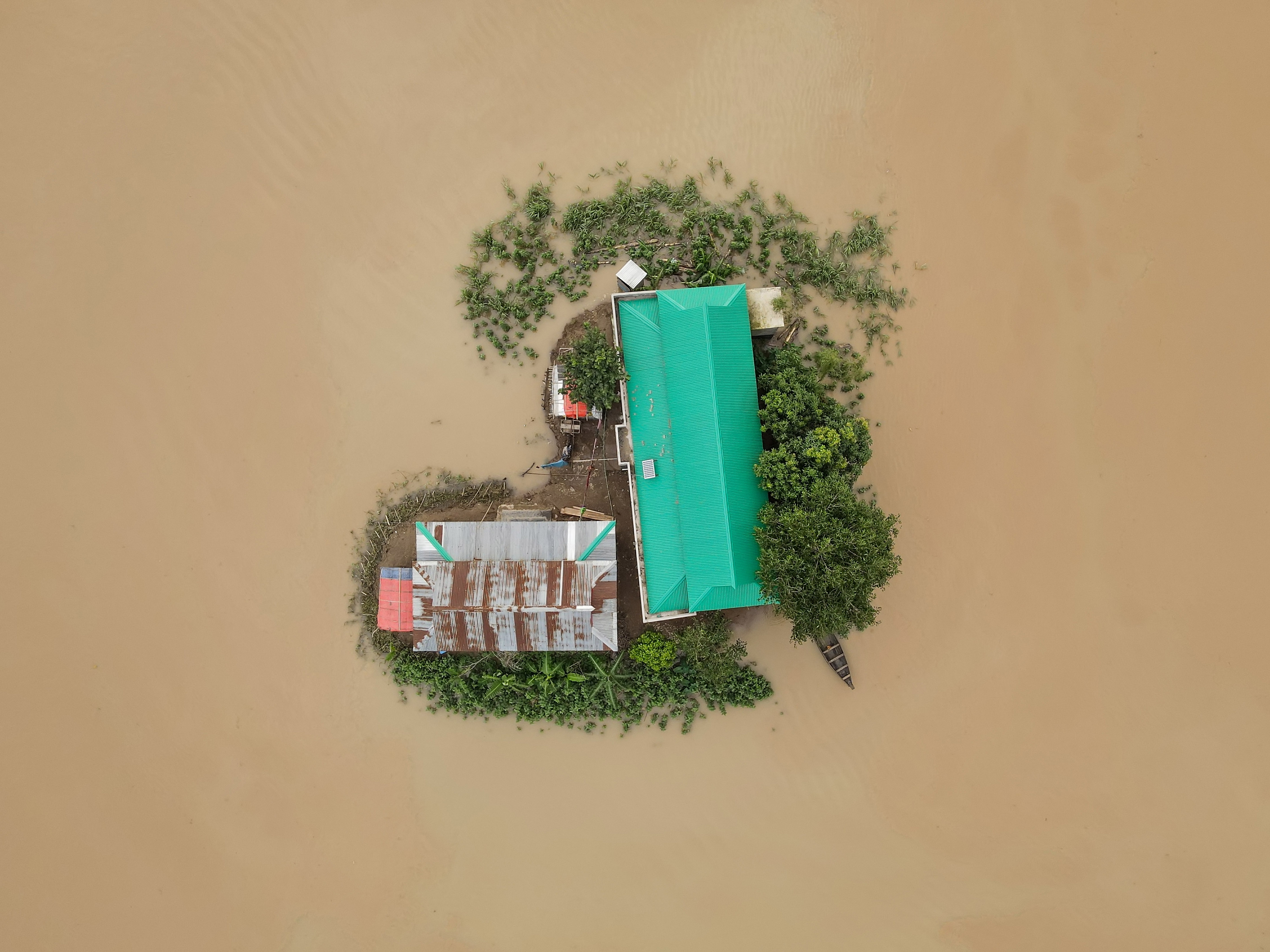 House surrounded by flood waters