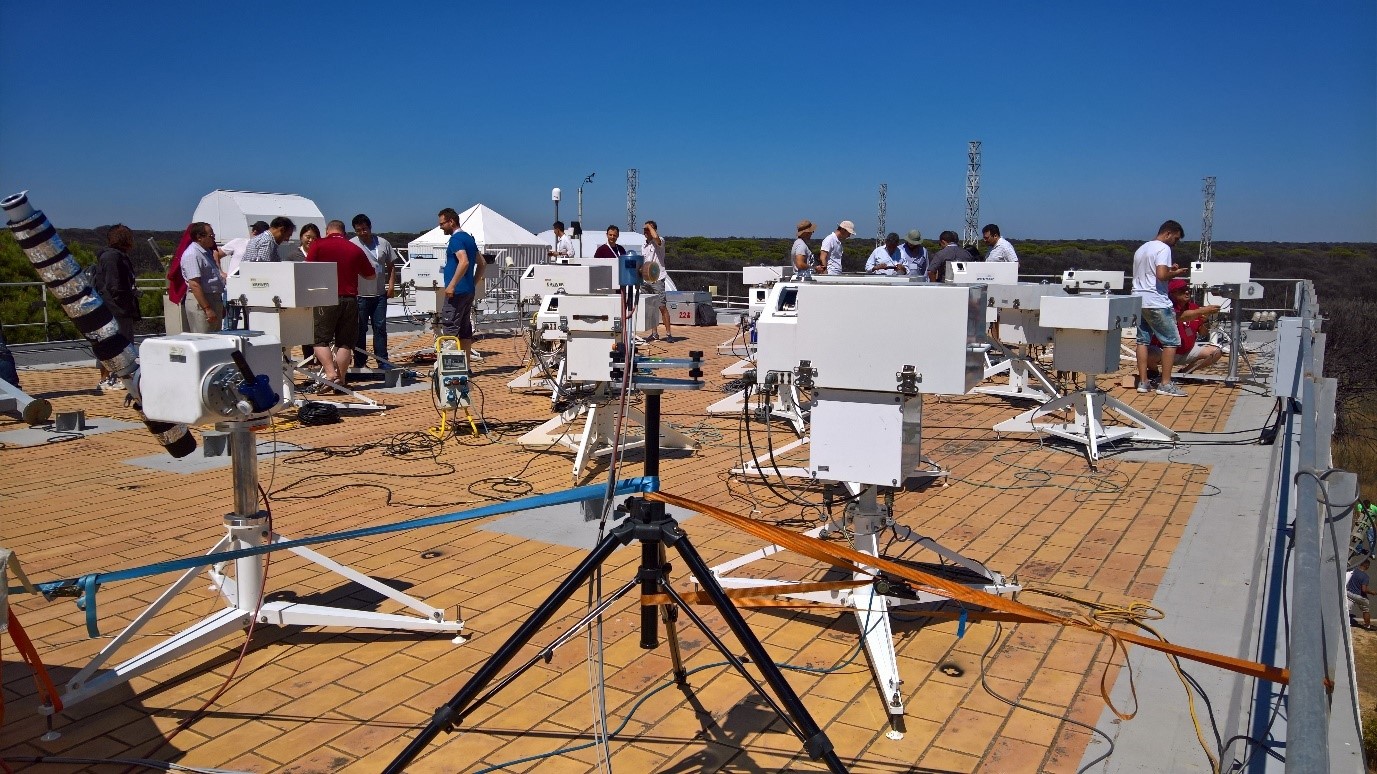 Solar UV intercomparison at the 12th RBCC-E campaign held from 17-27 June 2019 at El Arenosillo, INTA, Spain. The QASUME reference spectroradiometer is seen in the front with the Brewer spectroradiometers in the background