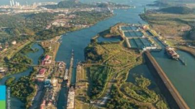 Aerial view of a canal with locks and surrounding greenery, featured on the cover of the 2023 "State of the Climate in Latin America and the Caribbean" report.