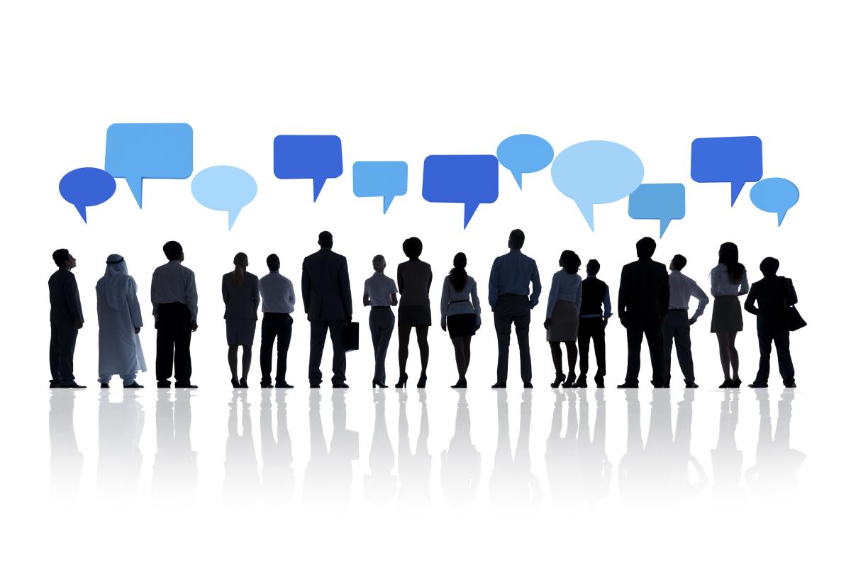 Silhouettes of people standing in a row with various blue speech bubbles above their heads, suggesting conversation or communication.